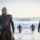 A group of Skrulls emerging from the sea.